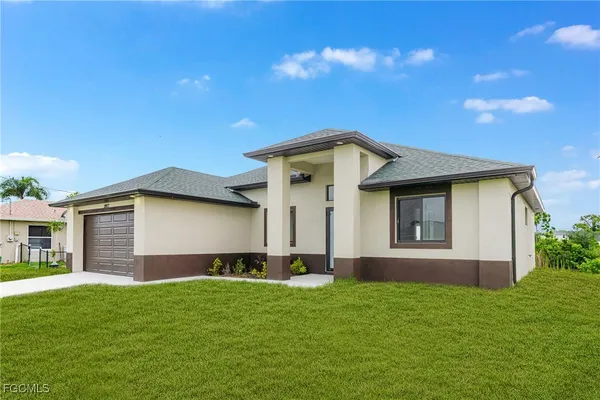 a front view of a house with a garden