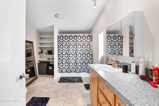 a kitchen with a sink a cabinets and refrigerator