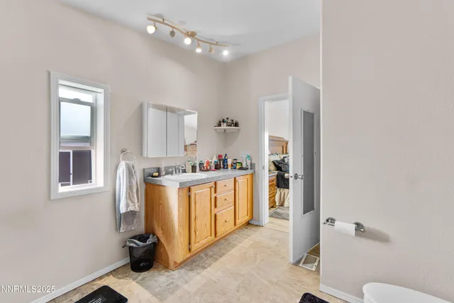 a kitchen with a refrigerator and a sink