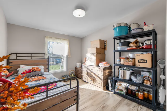 a bedroom with furniture and a book shelf