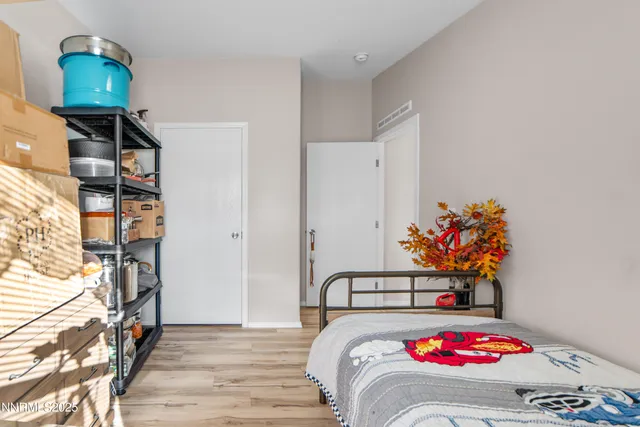 a bedroom with a bed and a dresser