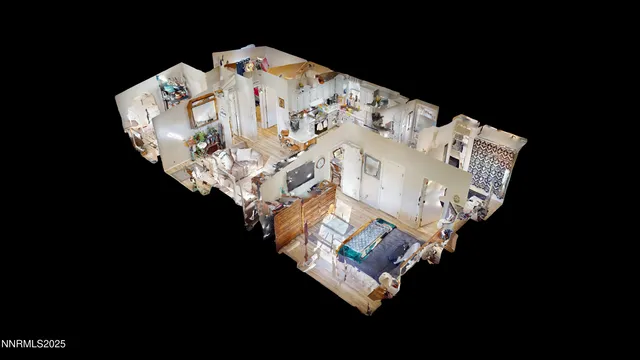 a white bed sitting in a bedroom next to a lamp