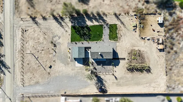 a view of a terrace with a table and chairs