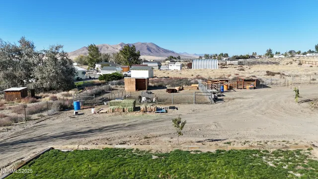 a view of a car parked in the middle of a field