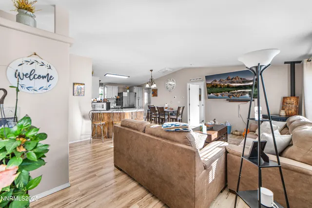 a living room with furniture and flowers