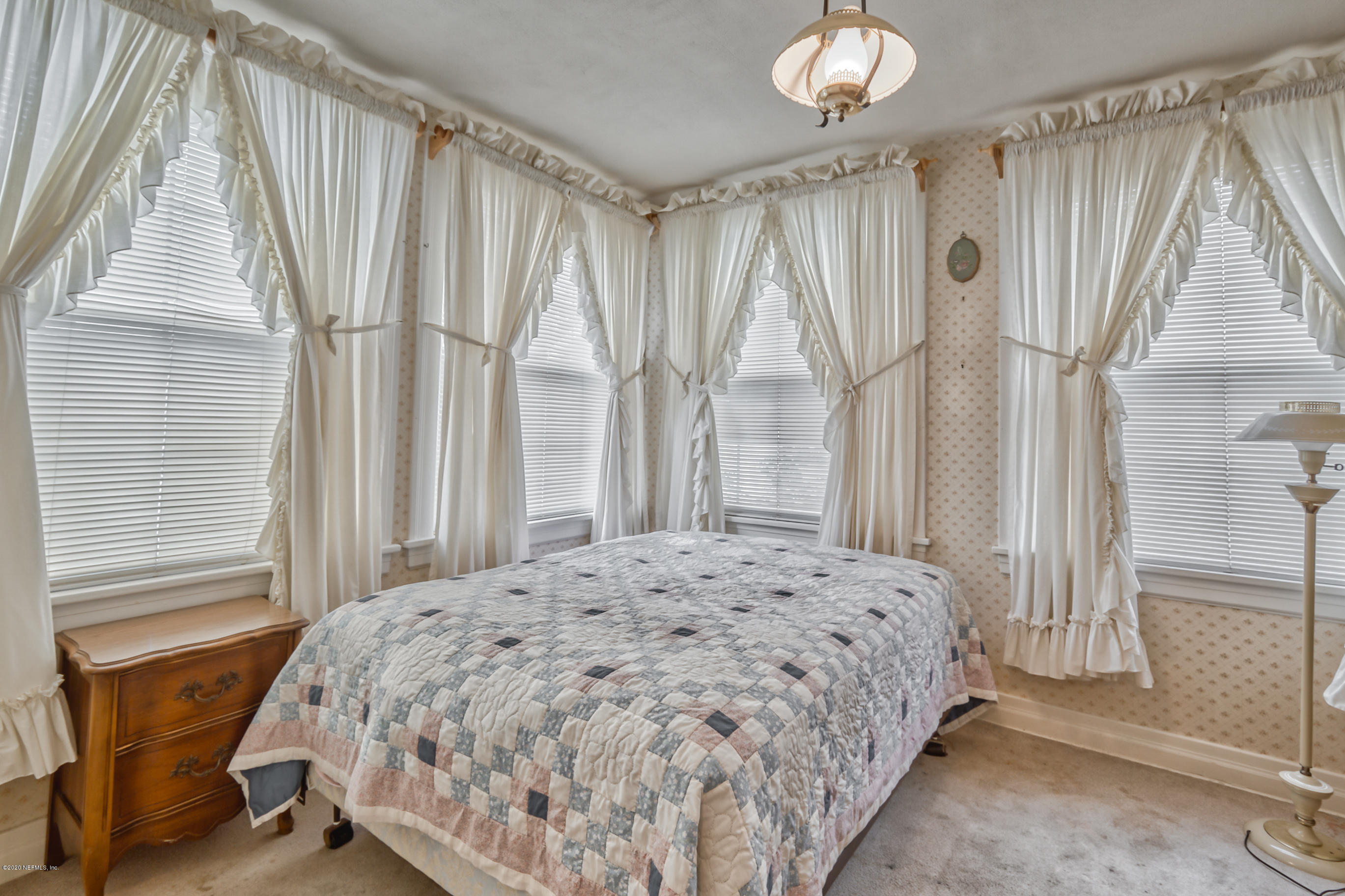 1011 Inwood Terrace Jacksonville, FL 32207 - Photo 14 of 21 a bedroom with a bed and a window