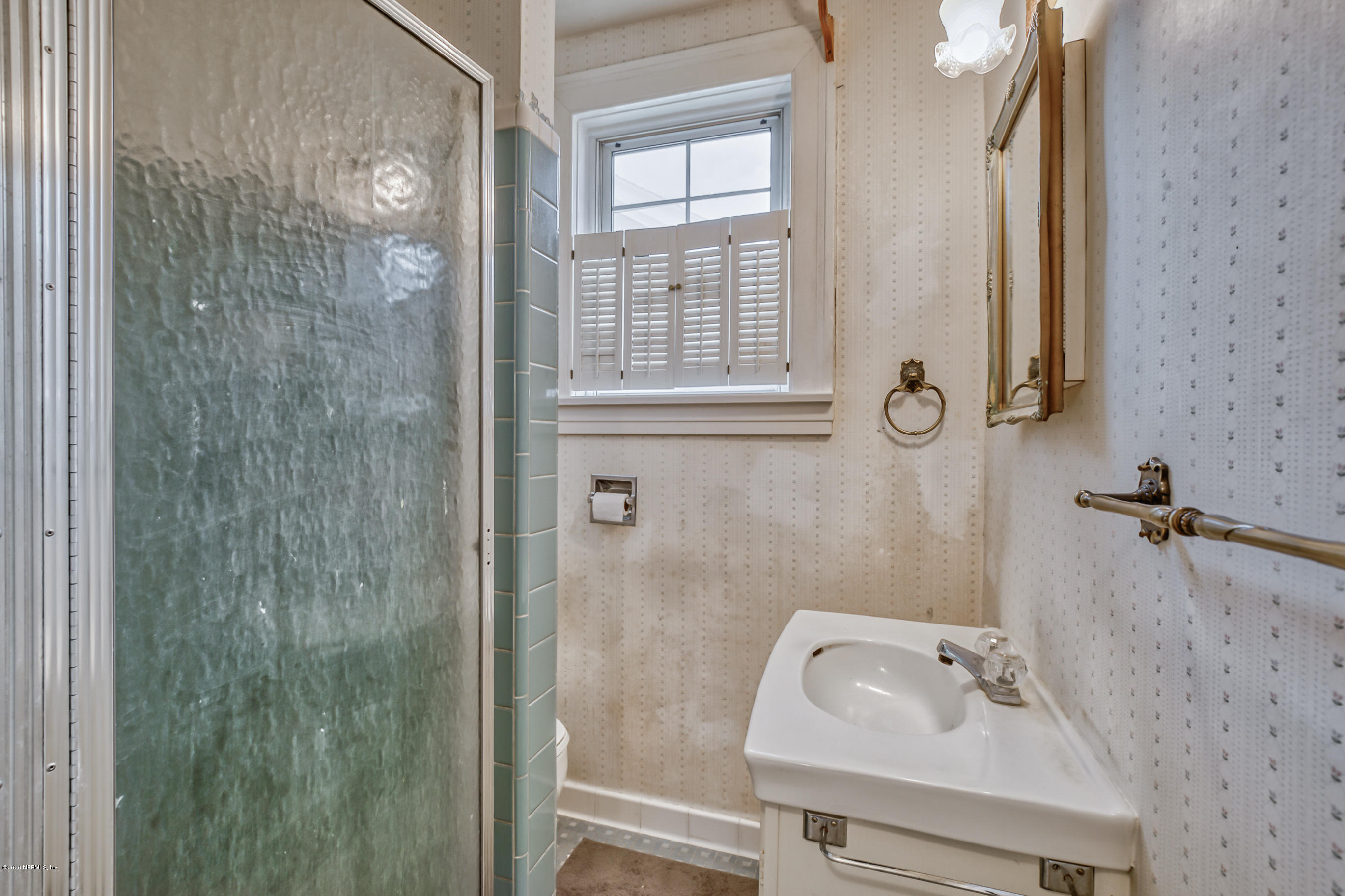 1011 Inwood Terrace Jacksonville, FL 32207 - Photo 15 of 21 a bathroom with a sink mirror and shower