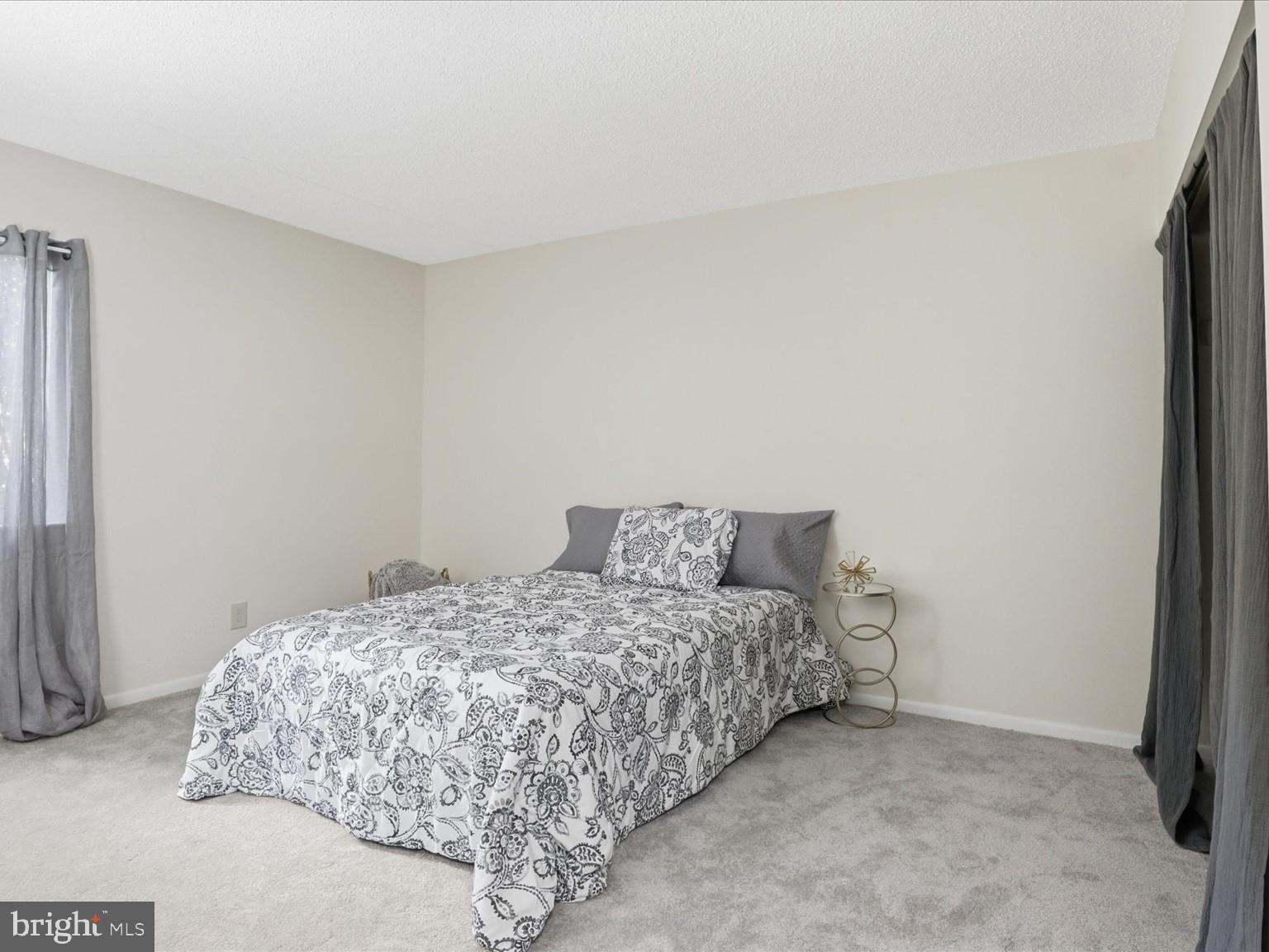 11809 Breton Court, Unit 2B Reston, VA 20191 - Photo 20 of 29 a bedroom with a bed and a window