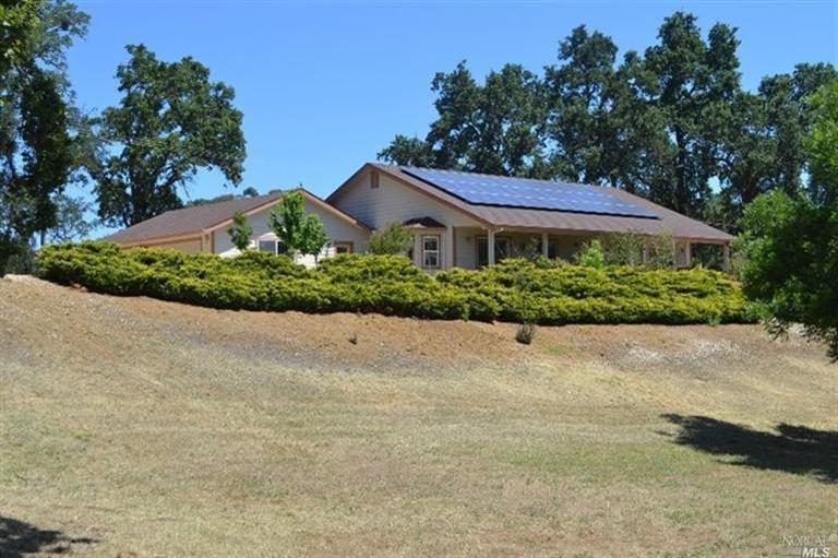 4685 Scotts Valley Road Lakeport, CA 95453 - Photo 1 of 1 a front view of a house with a garden