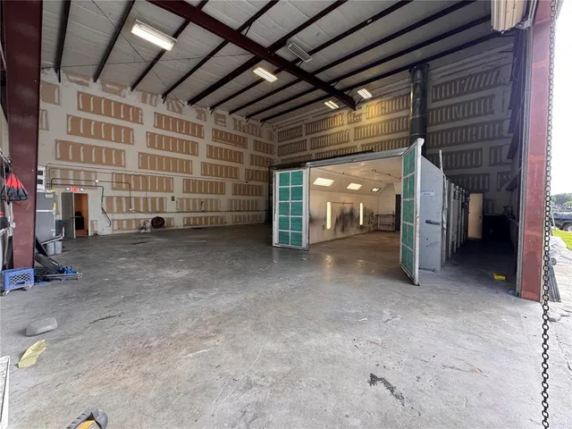 a view of empty room with a bathroom