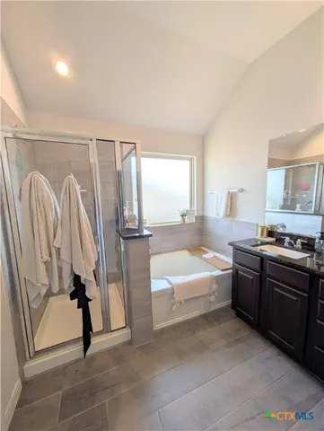 a large white room with a couch and a window