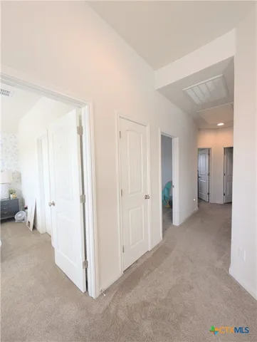 a view of a livingroom and a hallway