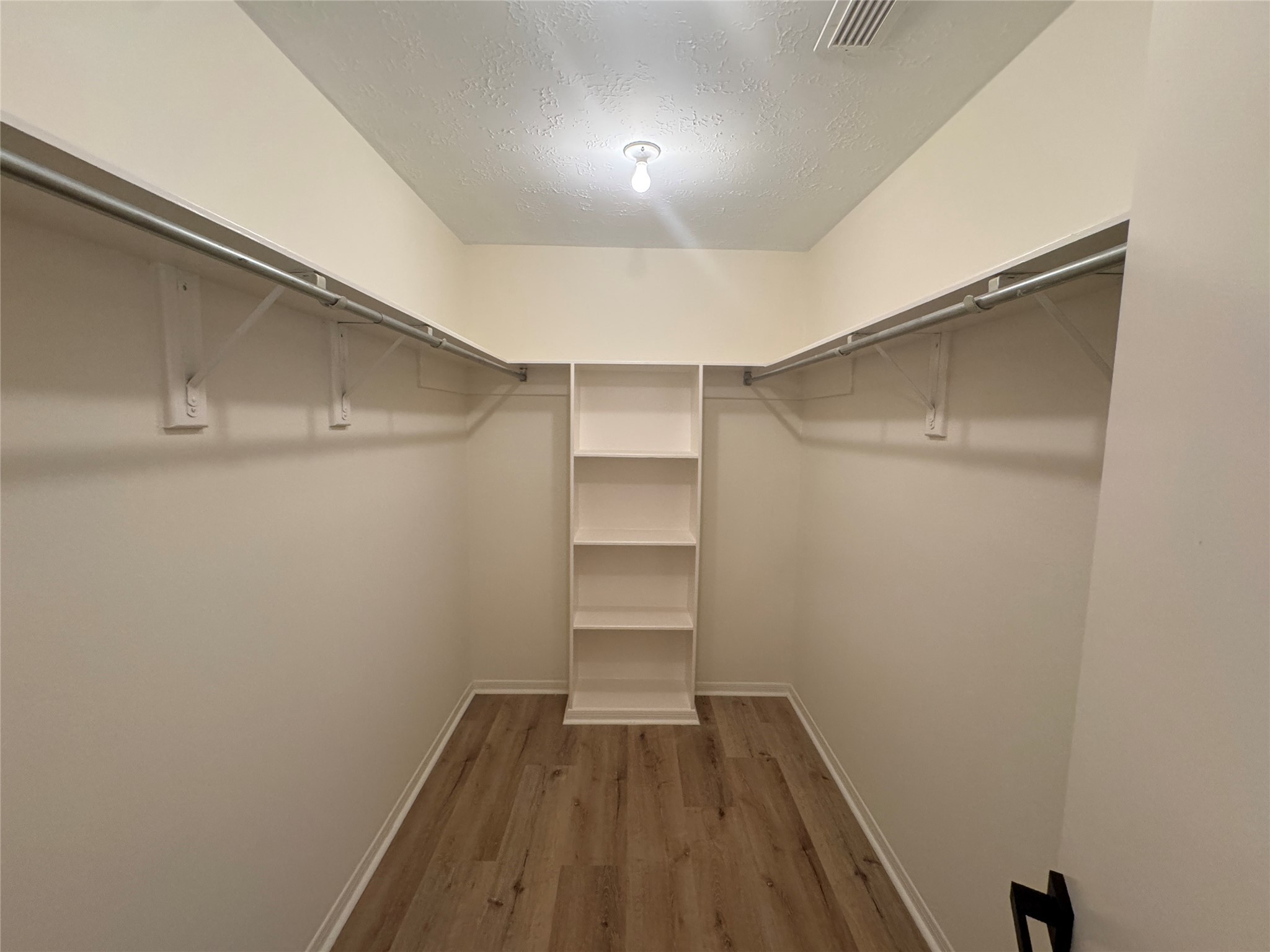12827 Waybridge Street Sugar Land, TX 77478 - Photo 12 of 23 a view of a room with wooden floor