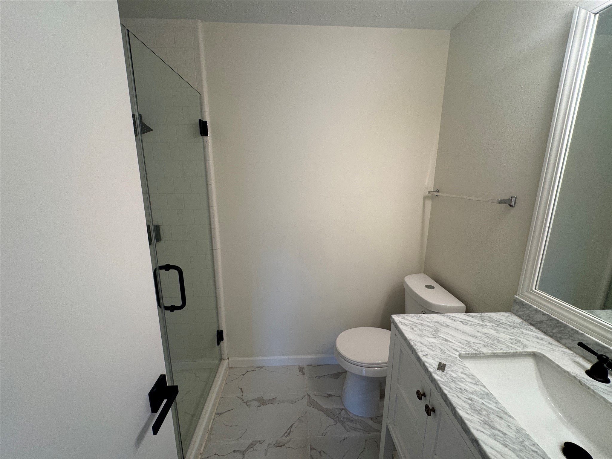 12827 Waybridge Street Sugar Land, TX 77478 - Photo 15 of 23 a bathroom with a granite countertop toilet and a sink