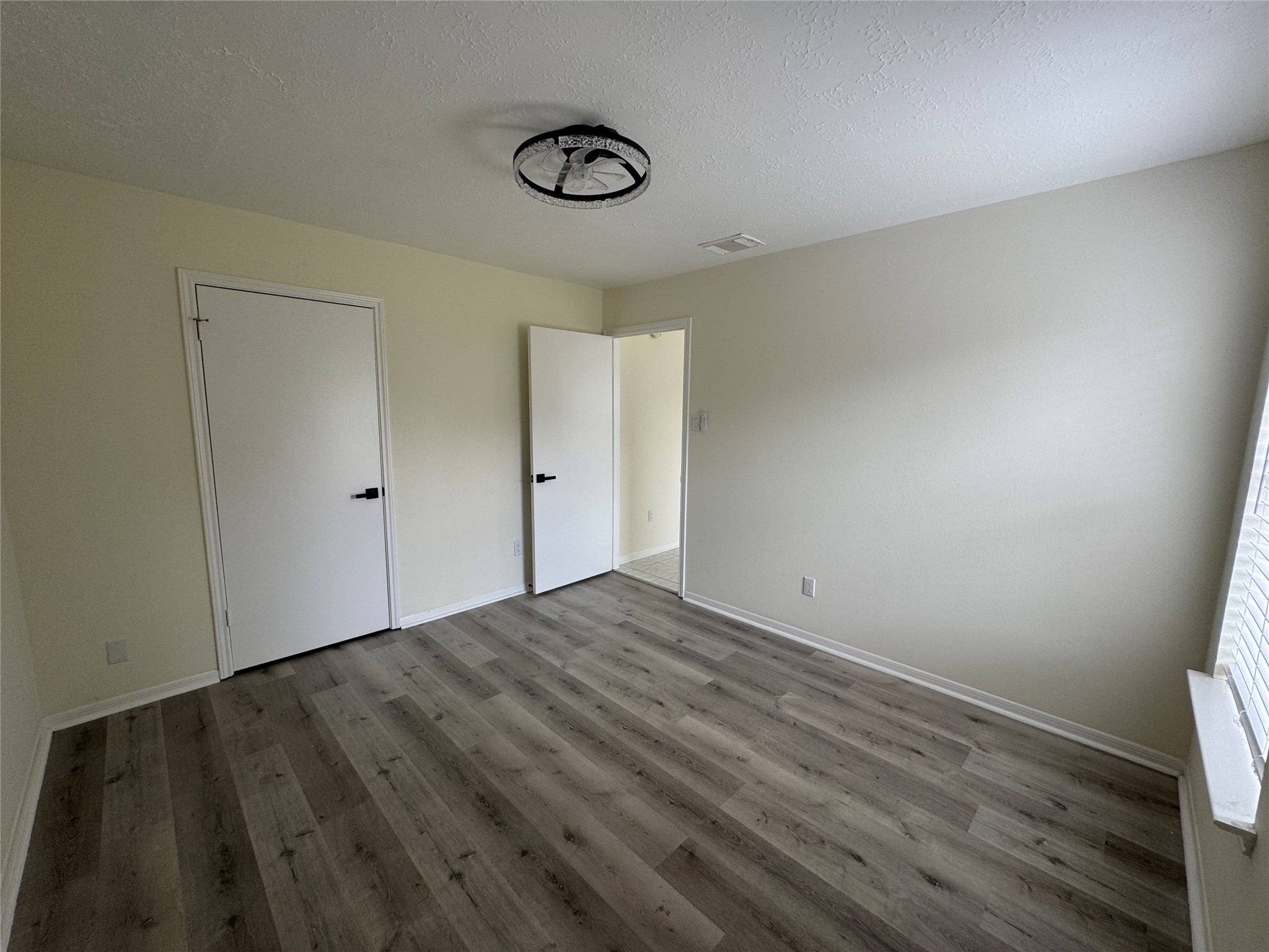 12827 Waybridge Street Sugar Land, TX 77478 - Photo 19 of 23 a view of empty room with wooden floor