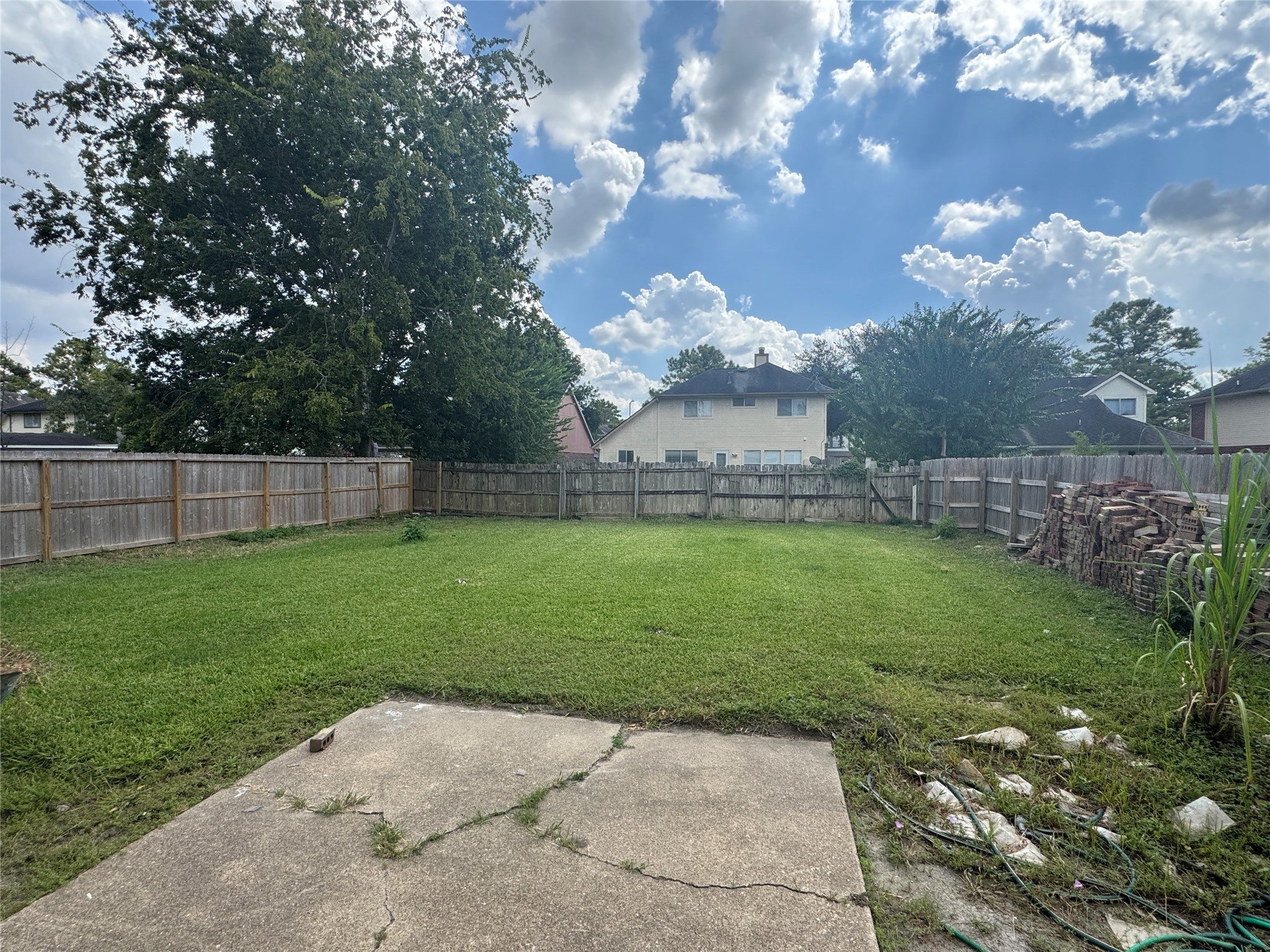 12827 Waybridge Street Sugar Land, TX 77478 - Photo 23 of 23 a view of a yard with a large tree