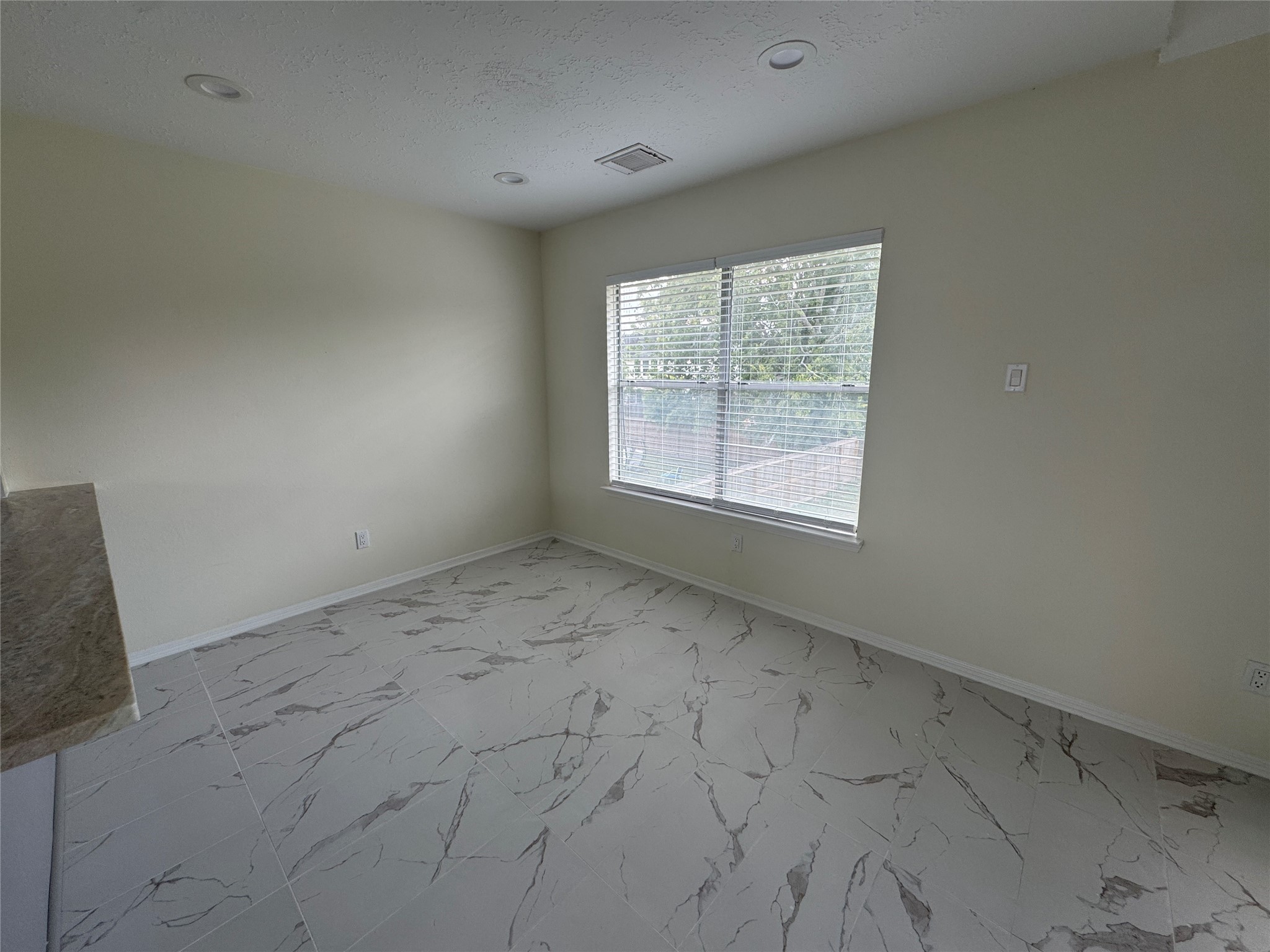 12827 Waybridge Street Sugar Land, TX 77478 - Photo 4 of 23 an empty room with a empty space and window