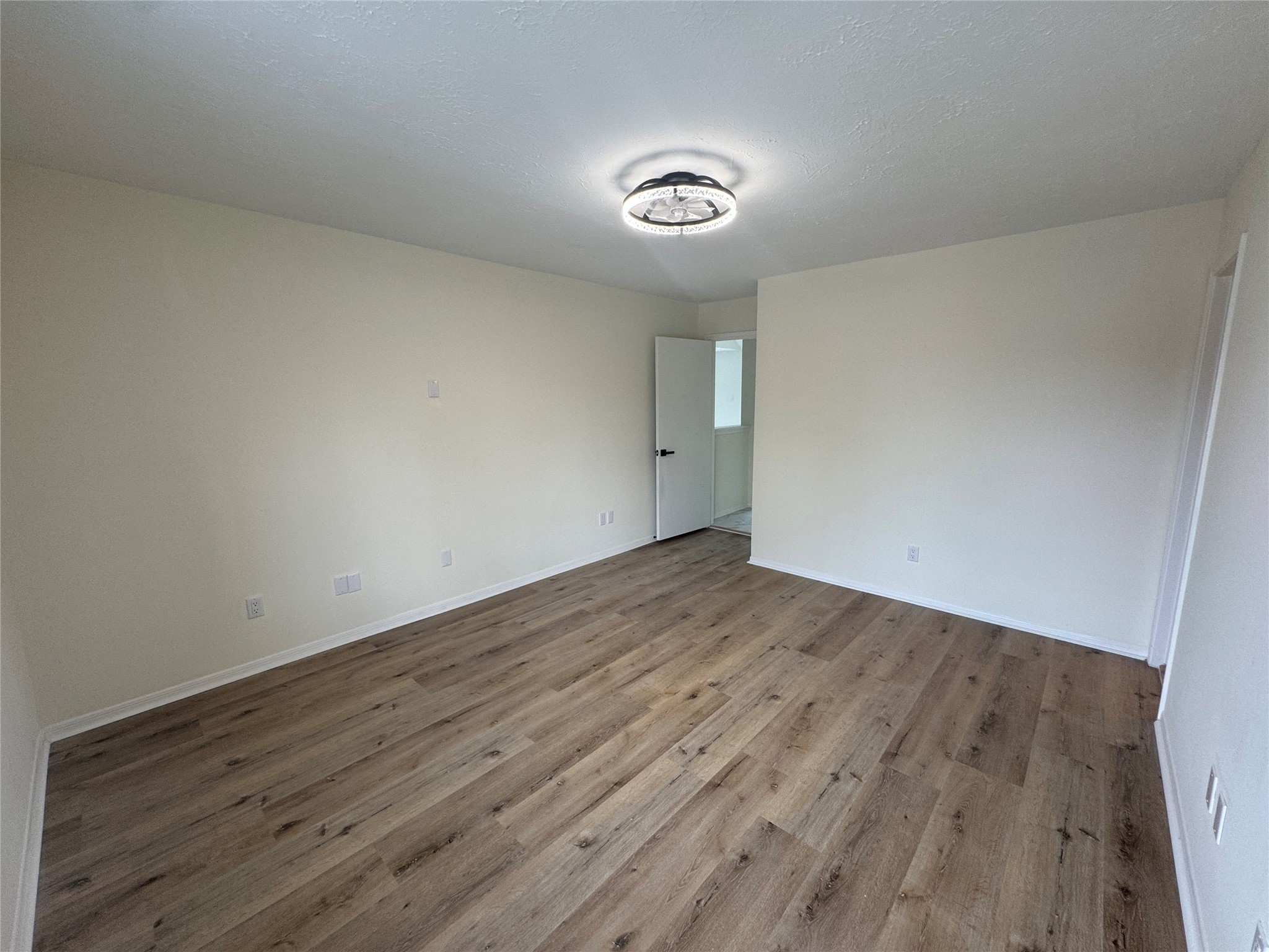 12827 Waybridge Street Sugar Land, TX 77478 - Photo 10 of 23 an empty room with wooden floor and windows