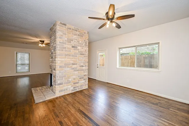 a view of livingroom with hardwood floor and a ceiling fan