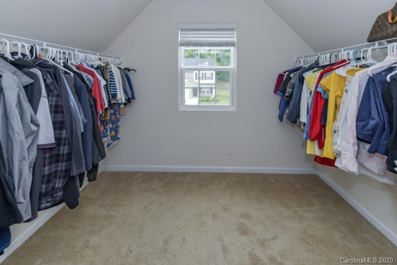 6565 Paw Village Road Charlotte, NC 28214 - Photo 11 of 26 a view of walk in closet with clothes and shoes