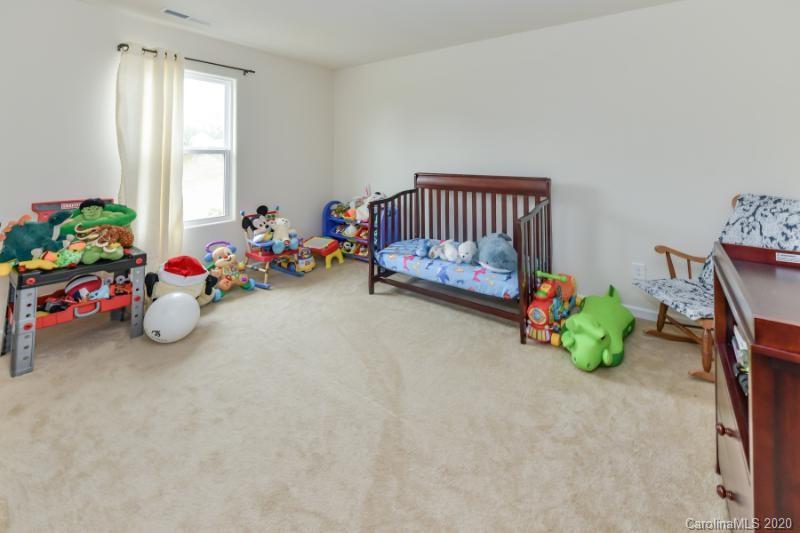 6565 Paw Village Road Charlotte, NC 28214 - Photo 14 of 26 a view of a kids room with toys