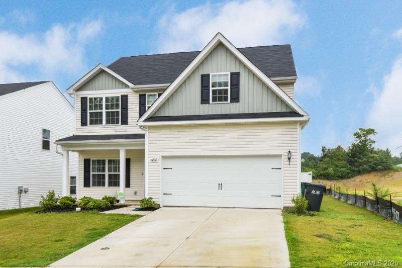 6565 Paw Village Road Charlotte, NC 28214 - Photo 17 of 26 a front view of a house with garden