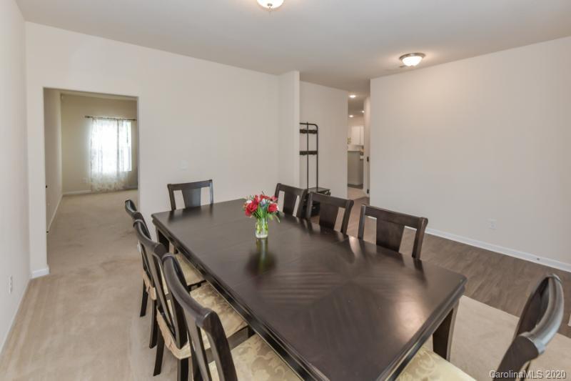 6565 Paw Village Road Charlotte, NC 28214 - Photo 3 of 26 a view of a dining room with furniture