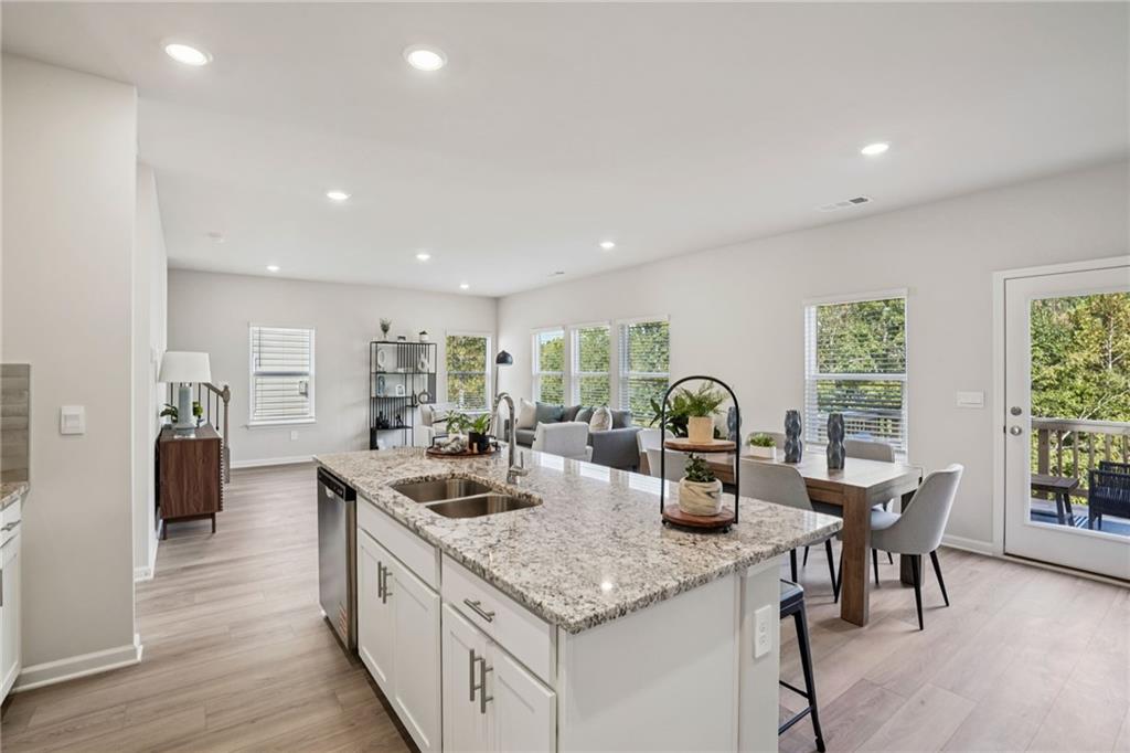 202 Proust Circle Dallas, GA 30132 - Photo 12 of 47 a kitchen with counter top space and living room
