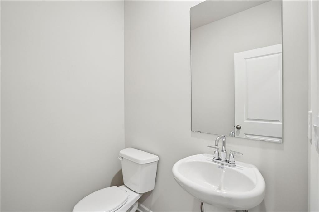 202 Proust Circle Dallas, GA 30132 - Photo 18 of 47 a bathroom with a sink and a toilet