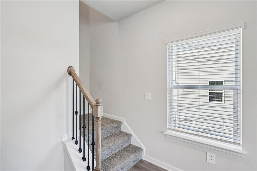 202 Proust Circle Dallas, GA 30132 - Photo 19 of 47 a view of entryway and hall with wooden floor
