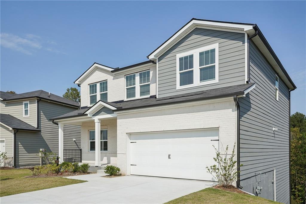 202 Proust Circle Dallas, GA 30132 - Photo 2 of 47 a front view of a house with a yard
