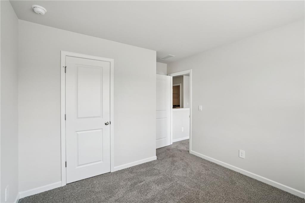 202 Proust Circle Dallas, GA 30132 - Photo 21 of 47 an empty room with windows