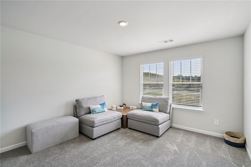 202 Proust Circle Dallas, GA 30132 - Photo 22 of 47 a bedroom with furniture and a window