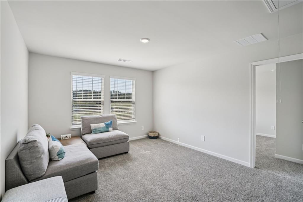 202 Proust Circle Dallas, GA 30132 - Photo 23 of 47 a living room with furniture and a large window