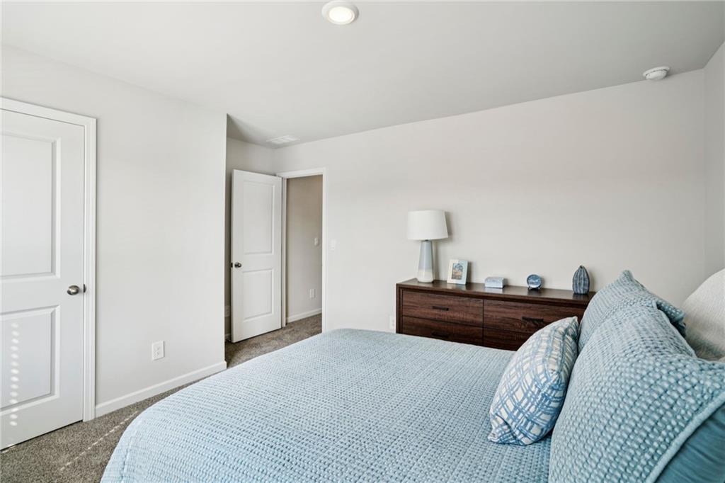 202 Proust Circle Dallas, GA 30132 - Photo 28 of 47 a bedroom with a bed and dresser