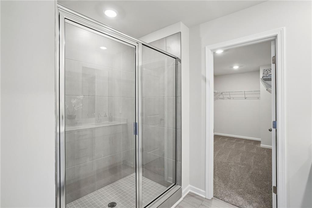202 Proust Circle Dallas, GA 30132 - Photo 33 of 47 a bathroom with a glass shower door