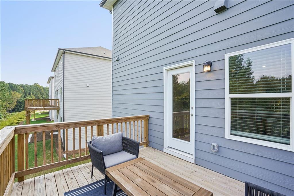 202 Proust Circle Dallas, GA 30132 - Photo 42 of 47 a balcony with wooden floor and furniture