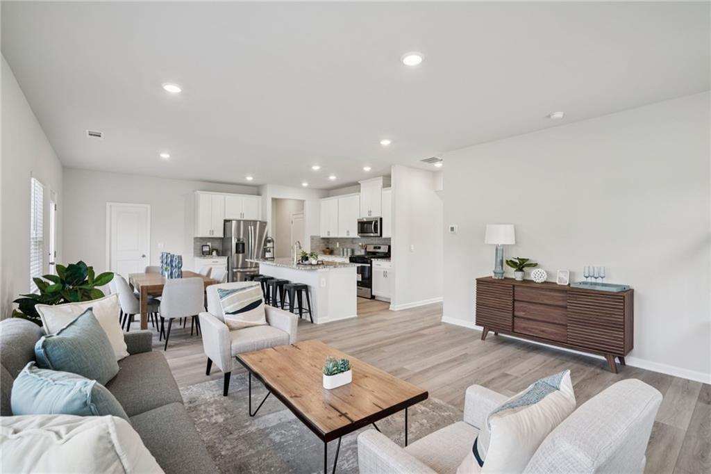 202 Proust Circle Dallas, GA 30132 - Photo 9 of 47 a living room with furniture kitchen view and a table