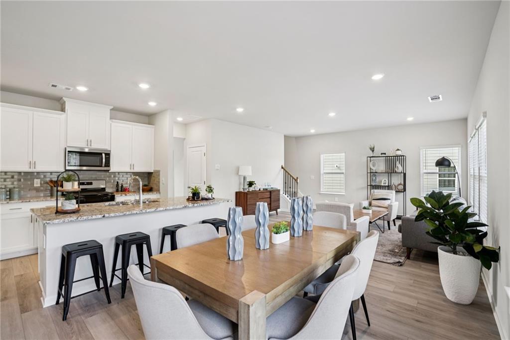 202 Proust Circle Dallas, GA 30132 - Photo 10 of 47 a large kitchen with a table and chairs