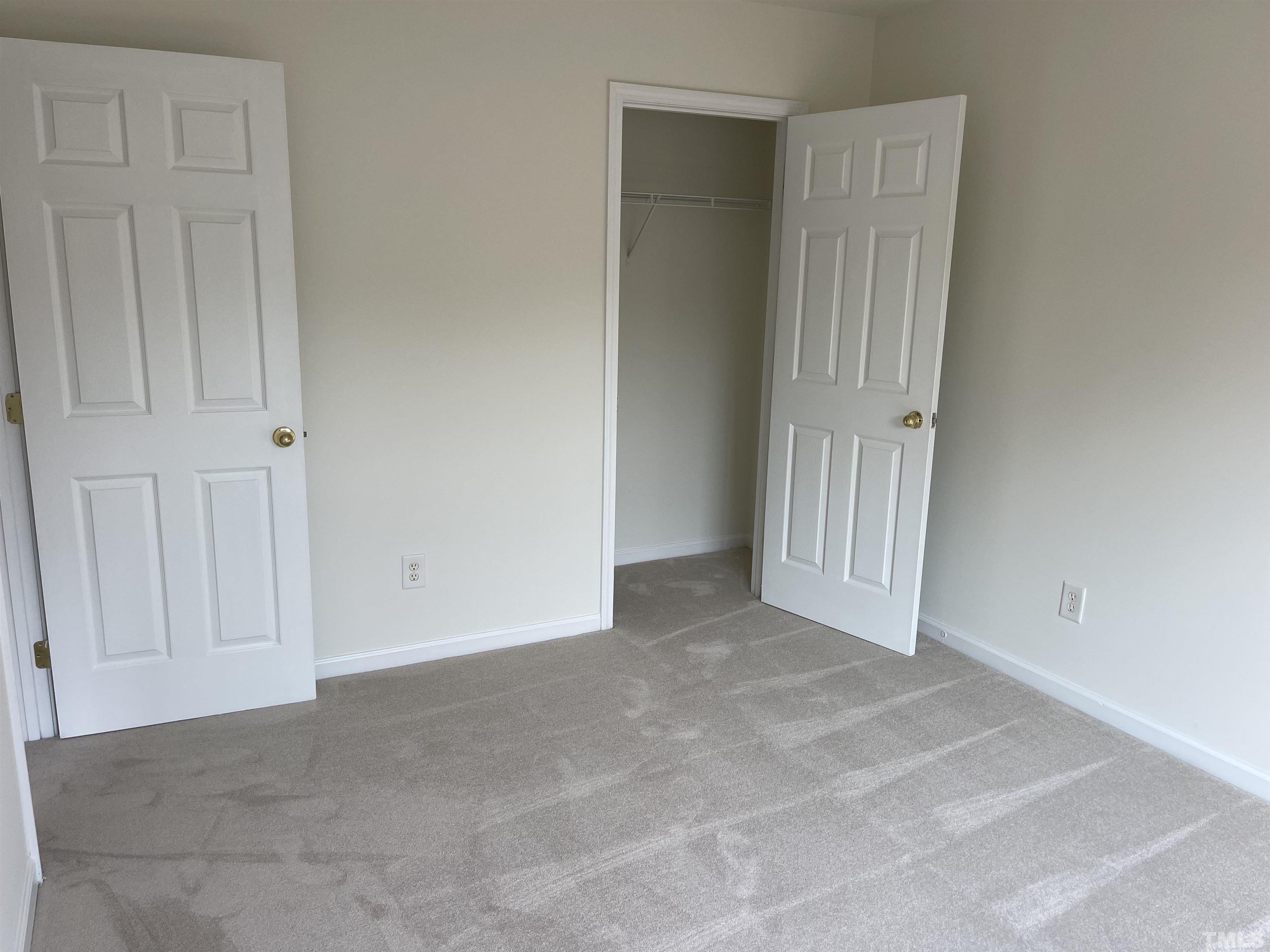 8521 Bright Loop Raleigh, NC 27613 - Photo 17 of 20 a view of a livingroom with entryway