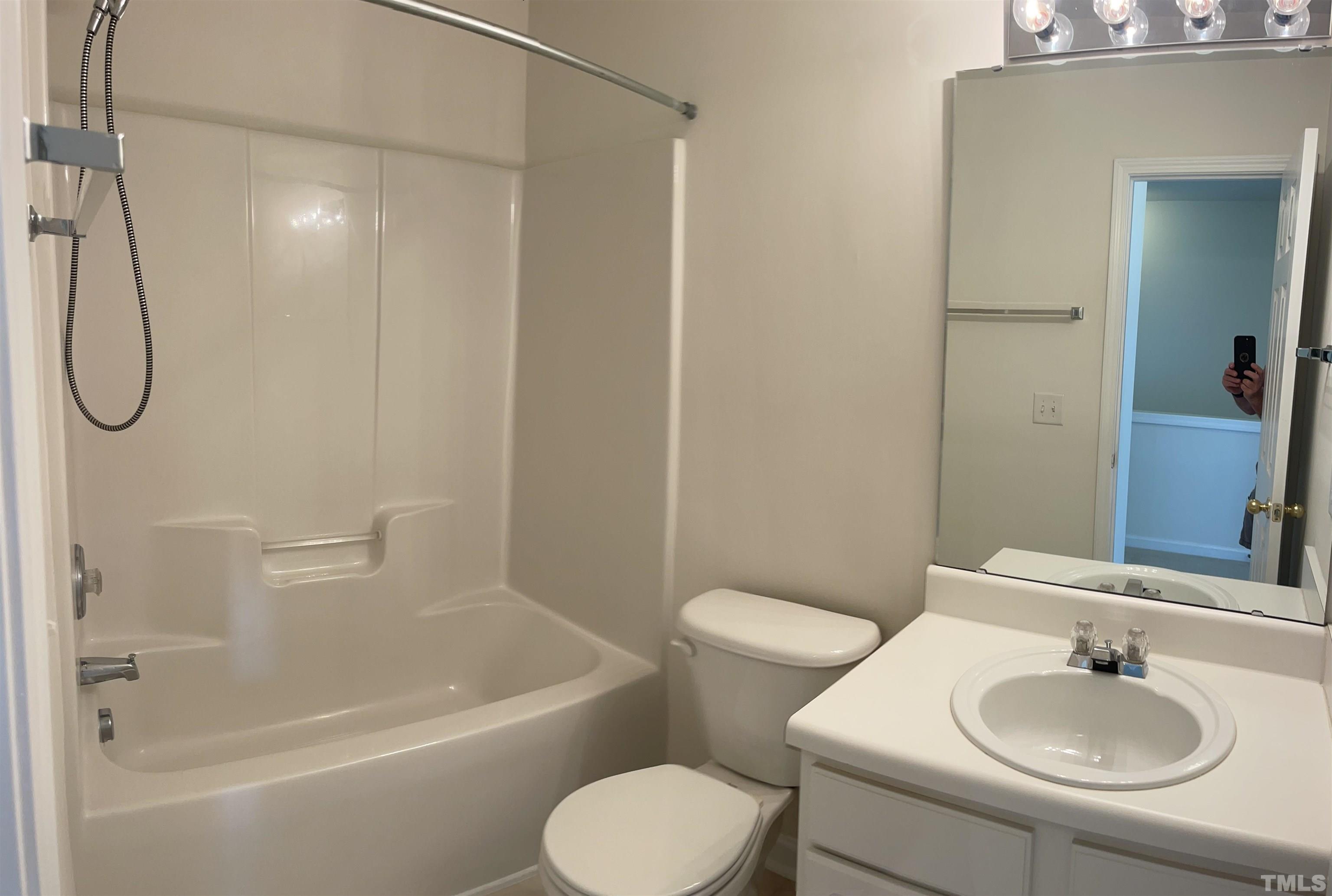 8521 Bright Loop Raleigh, NC 27613 - Photo 18 of 20 a bathroom with a sink toilet and shower