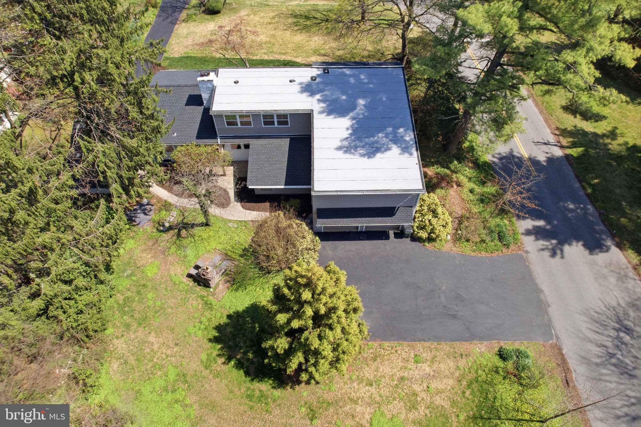 409 South Providence Road Wallingford, PA 19086 - Photo 99 of 106 Modern home nestled in lush greenery.