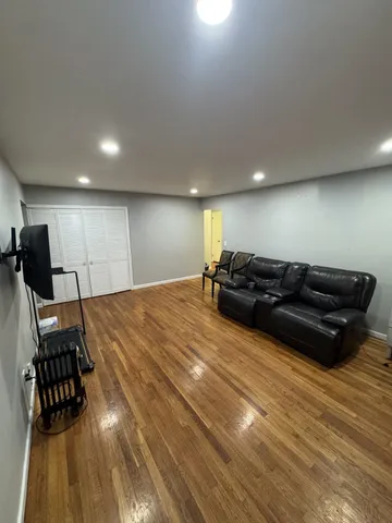 a bed room with a bed and a chair