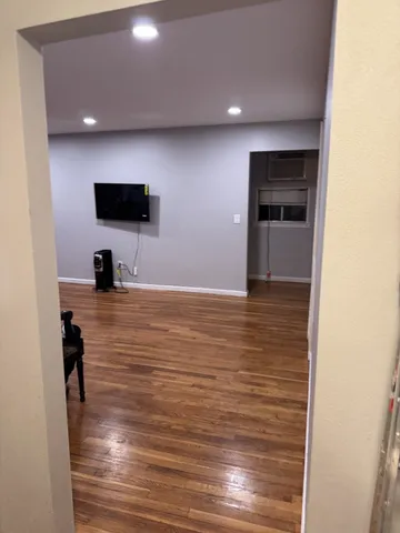 a room with furniture and a flat screen tv