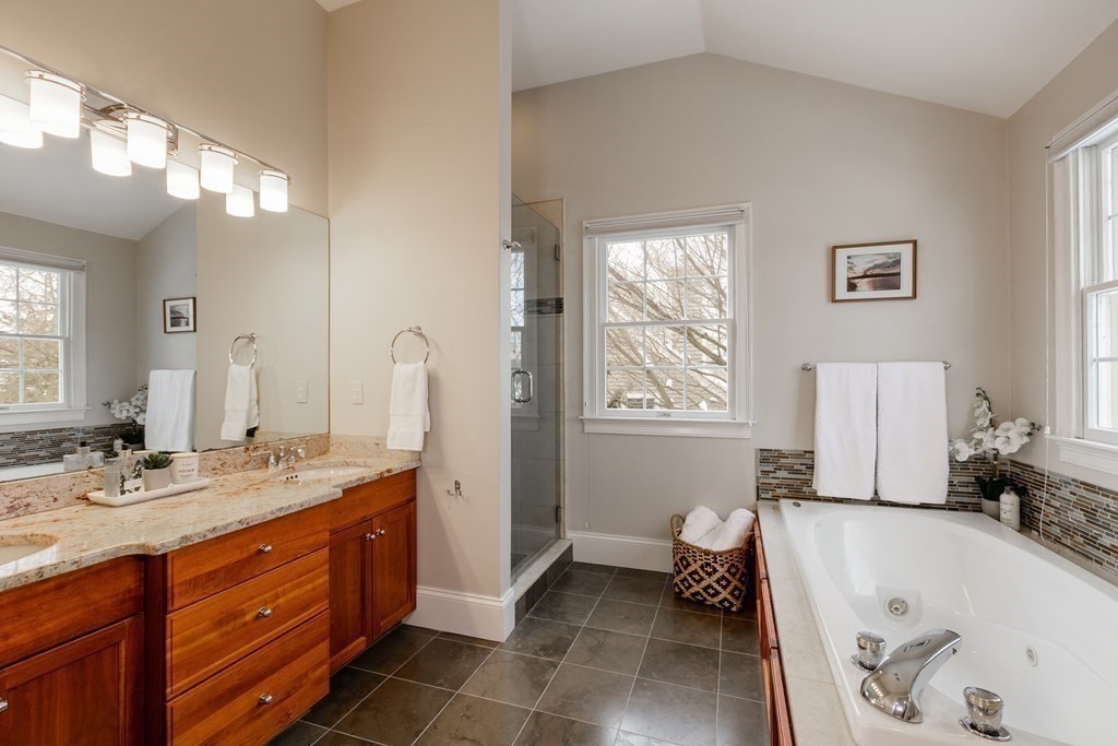 29 Old Bridge Road Concord, MA 01742 - Photo 20 of 37 a spacious bathroom with a tub sink and a mirror