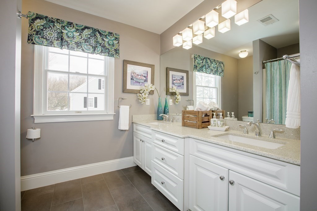 29 Old Bridge Road Concord, MA 01742 - Photo 23 of 37 a spacious bathroom with double sink large mirror and a window