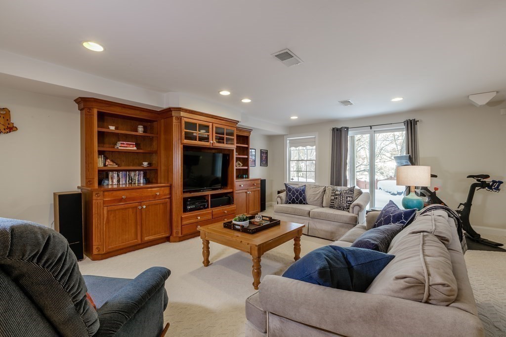 29 Old Bridge Road Concord, MA 01742 - Photo 26 of 37 a living room with furniture and a flat screen tv