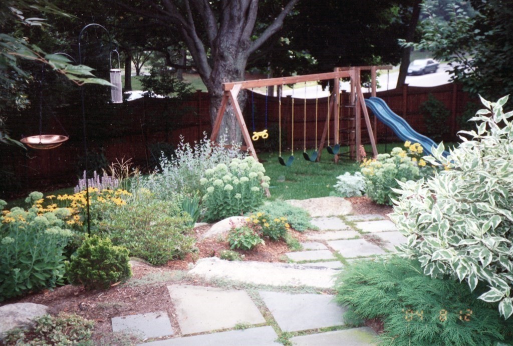 29 Old Bridge Road Concord, MA 01742 - Photo 34 of 37 a view of a house with a yard and potted plants
