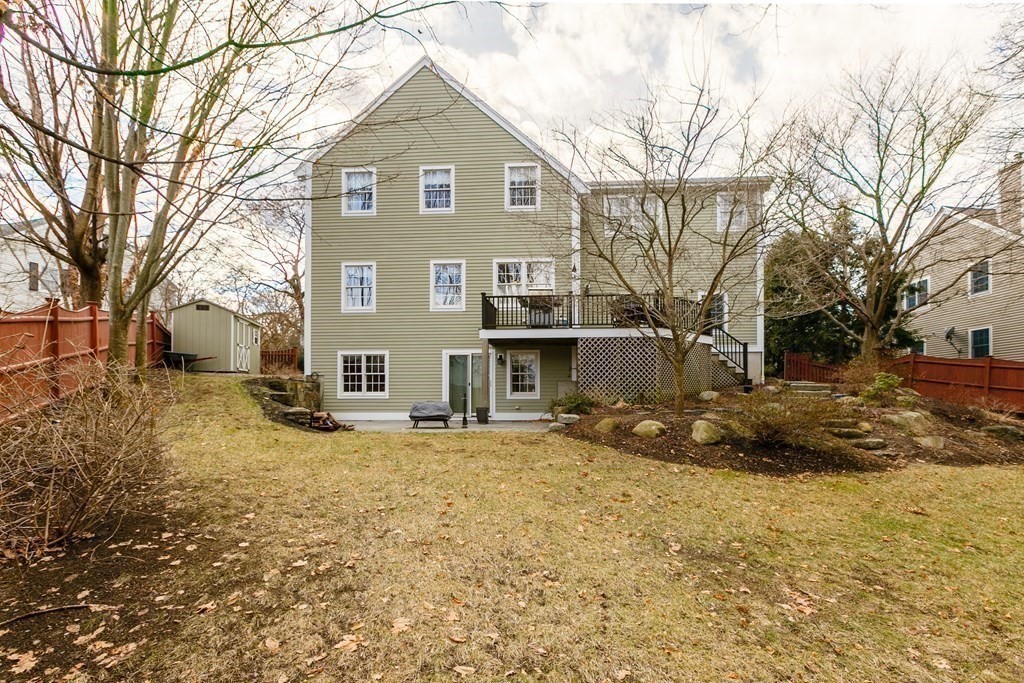 29 Old Bridge Road Concord, MA 01742 - Photo 36 of 37 a front view of a house with a yard covered in snow