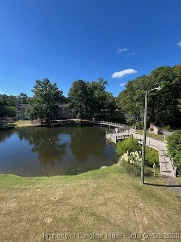 a view of a lake with a house in the background